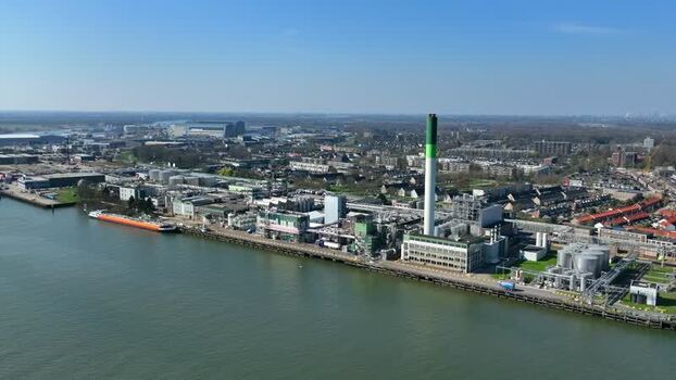 Aerial view of an industrial plant with a tall chimney Netherlands.