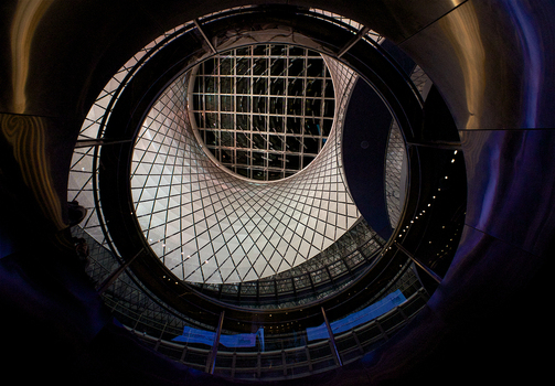 View of the geometric glass oculus and mesh ceiling at the Fulton Center subway station New York New York United States. View of the geometric glass oculus and mesh ceiling at the Fulton Center subway station New York New York United States.