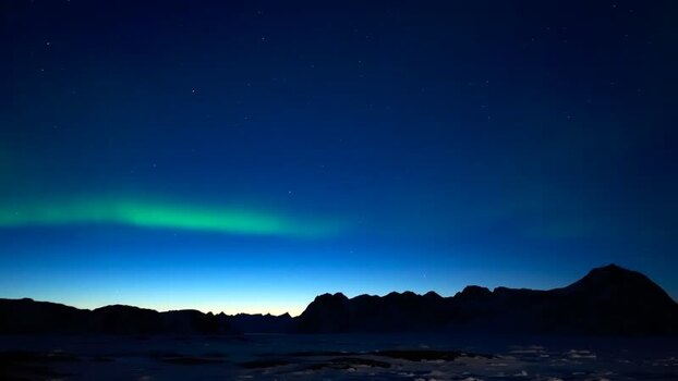 Aerial view of Aurora Borealis over mountains Greenland. Aerial view of Aurora Borealis over mountains Greenland.