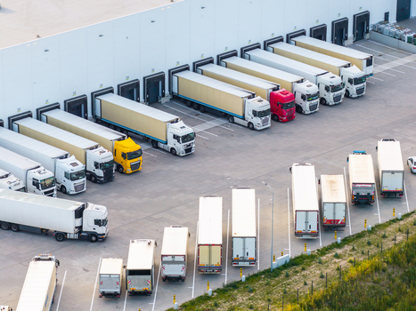 Aerial view of a logistics center with numerous semi trucks parked at loading docks showcasing efficient distribution infrastructure in Kowale Wojewodztwo pomorskie Poland. Aerial view of a logistics center with numerous semi trucks parked at loading docks showcasing efficient distribution infrastructure in Kowale Wojewodztwo pomorskie Poland.
