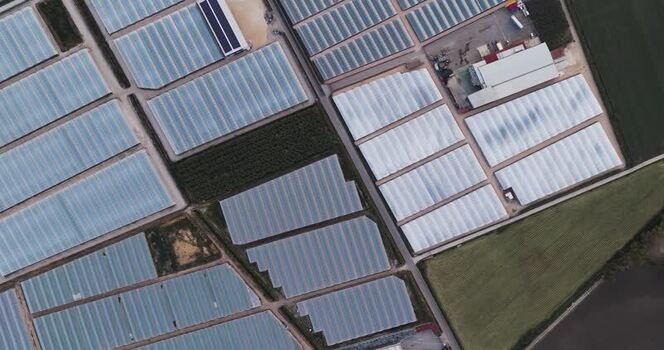 Aerial view of greenhouses and agricultural fields Italy.