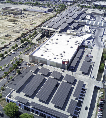 Aerial view of solar panel structures installed on the parking roof of a shopping mall in San Fernando California United States. Aerial view of solar panel structures installed on the parking roof of a shopping mall in San Fernando California United States.
