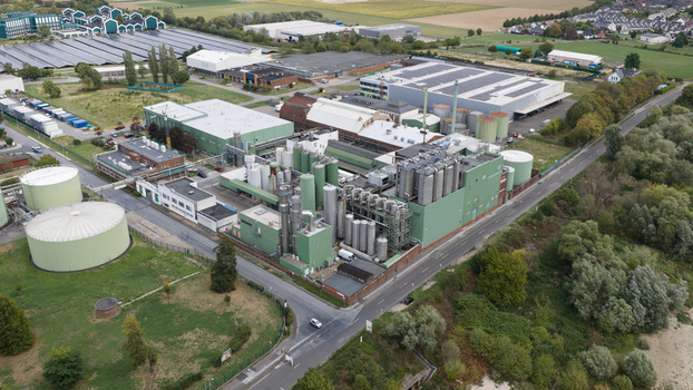 Monheim am Rhein Germany 04 September 2026 Aerial view of the UNIFERM GmbH Co. KG industrial site with large storage tanks factory buildings and surrounding green areas.
