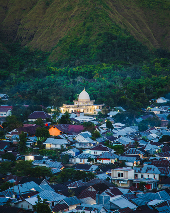 Aerial view of the village of Sembalun with its prominent mosque nestled in an agricultural basin at the foothills of Mount Rinjani in Sembalun West Nusa Tenggara Indonesia. Aerial view of the village of Sembalun with its prominent mosque nestled in an agricultural basin at the foothills of Mount Rinjani in Sembalun West Nusa Tenggara Indonesia.