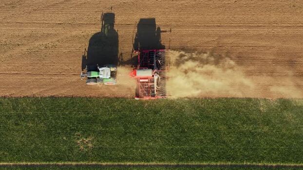 Aerial view of a tractor seeding a field Czechia. Aerial view of a tractor seeding a field Czechia.