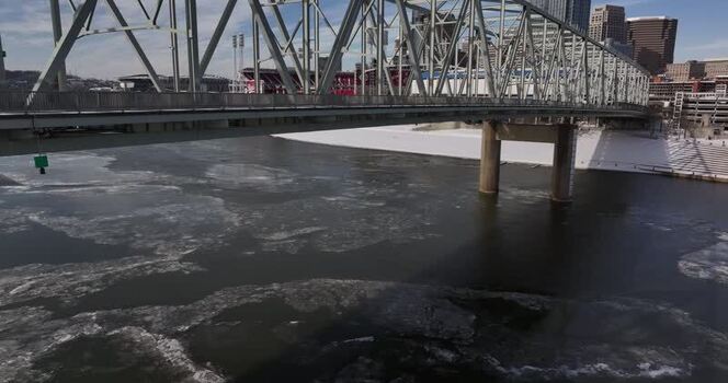 Aerial view of a steel truss bridge and frozen river United States. Aerial view of a steel truss bridge and frozen river United States.