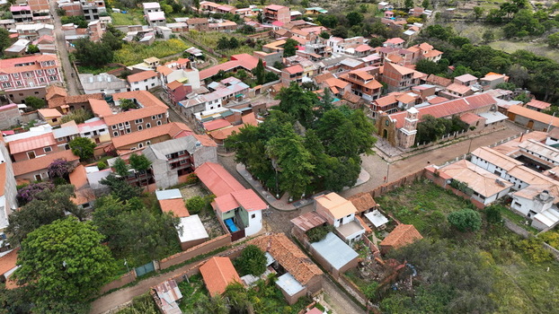 Torotoro Bolivia 29 September 2026 Aerial view of the town of Torotoro featuring its central square with lush trees historic buildings with terracotta rooftops and the local church.