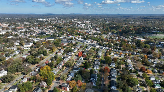 Aerial view of the city of Lynchburg featuring residential neighborhoods autumn foliage and urban infrastructure in Lynchburg Virginia United States.