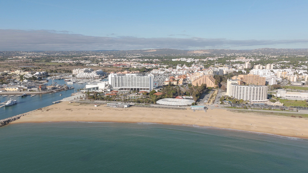 Aerial view of Vilamoura marina and beach with hotels boats and coastal landscape in Quarteira Faro District Portugal.