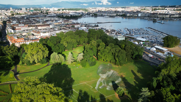 Aerial view of verdant parkland meets the shimmering waters of Lake Geneva nestled against a backdrop of urban architecture Gen&egrave;ve Gen&egrave;ve Switzerland.
