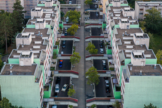 Aerial view of High Deck Siedlung housing complex featuring green facades pedestrian bridges and parked cars in Berlin Berlin Germany. Aerial view of High Deck Siedlung housing complex featuring green facades pedestrian bridges and parked cars in Berlin Berlin Germany.