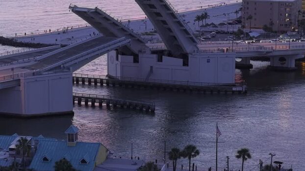 Aerial view of John s Pass Bridge opening at twilight United States. Aerial view of John s Pass Bridge opening at twilight United States.