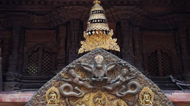 View of ornate golden temple carvings Nepal.