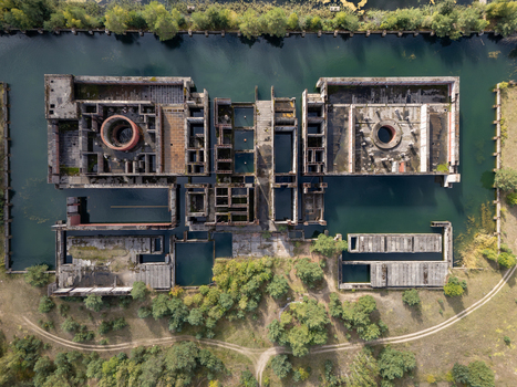 Aerial view of the abandoned foundations of the unfinished Zarnowiec nuclear power plant surrounded by water and greenery in Zarnowiec Poland. Aerial view of the abandoned foundations of the unfinished Zarnowiec nuclear power plant surrounded by water and greenery in Zarnowiec Poland.