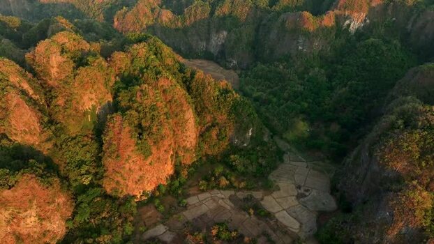 Aerial view of karst mountains and lush valleys in Maros Indonesia. Aerial view of karst mountains and lush valleys in Maros Indonesia.
