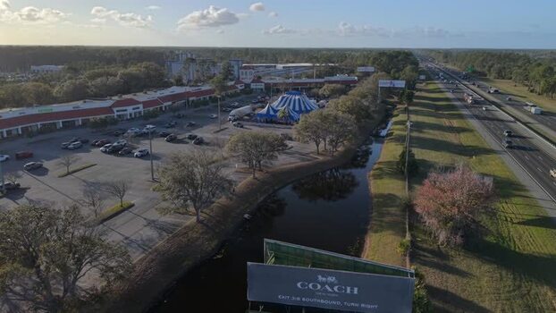 Aerial view of a circus tent near a mall United States. Aerial view of a circus tent near a mall United States.