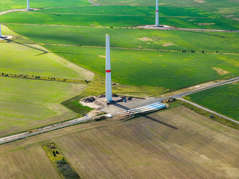 Aerial view of Windpark Forst Briesnig II with a wind turbine tower and blades lying on the ground in the recultivated landscape of Forst Brandenburg Germany. Aerial view of Windpark Forst Briesnig II with a wind turbine tower and blades lying on the ground in the recultivated landscape of Forst Brandenburg Germany.