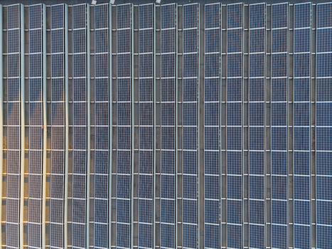 Aerial view of solar panels installed on a large industrial rooftop in Hasselt Flanders Belgium. Aerial view of solar panels installed on a large industrial rooftop in Hasselt Flanders Belgium.