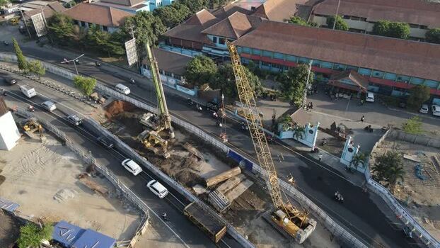 Aerial view of road construction site with heavy cranes Indonesia. Aerial view of road construction site with heavy cranes Indonesia.