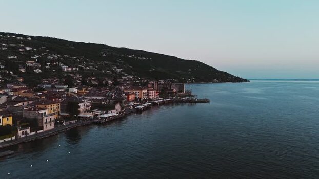 Aerial view of a lakeside town on Lake Garda at dusk Italy. Aerial view of a lakeside town on Lake Garda at dusk Italy.
