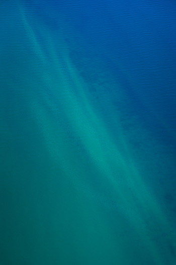 Aerial view of turquoise ocean patterns and deep blue water currents in the Shire of Shark Bay Western Australia Australia. Aerial view of turquoise ocean patterns and deep blue water currents in the Shire of Shark Bay Western Australia Australia.