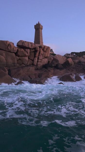 Aerial view of Phare de Men Ruz on granite coast France.