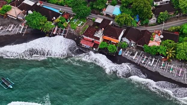 Aerial view of coastal village with traditional boats Indonesia.