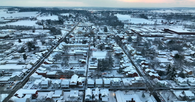 Aerial view of the snow covered residential streets and houses of Manheim during winter in Manheim Pennsylvania United States.
