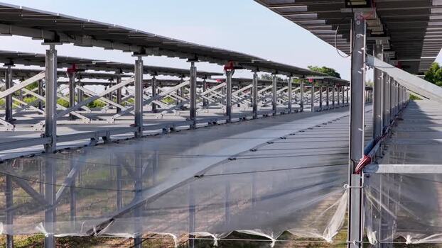 Aerial view of agrivoltaic solar panels in Faenza Italy.