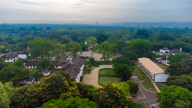 Aerial view of Achimota School campus featuring historic colonial style buildings lush green trees paved pathways and manicured lawns in Achimota Greater Accra Region Ghana. Aerial view of Achimota School campus featuring historic colonial style buildings lush green trees paved pathways and manicured lawns in Achimota Greater Accra Region Ghana.