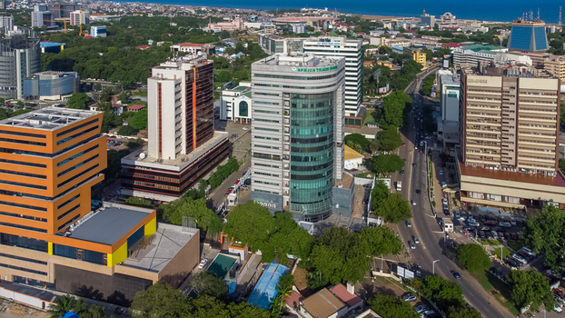 Accra Ghana 26 May 2023 Aerial view of the modern skyline in Accra featuring glass fronted office buildings lush green trees and busy city streets under a clear sky. Accra Ghana 26 May 2023 Aerial view of the modern skyline in Accra featuring glass fronted office buildings lush green trees and busy city streets under a clear sky.