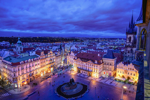 Aerial view of the historic Old Town Square in Prague featuring the Church of Our Lady before Tyn illuminated buildings and cobblestone streets in Prague Prague Czechia. Aerial view of the historic Old Town Square in Prague featuring the Church of Our Lady before Tyn illuminated buildings and cobblestone streets in Prague Prague Czechia.