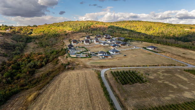 Aerial view of Ruza vetrova resort featuring modern villas nestled in the hilly landscape of Fruska Gora with surrounding forests and vineyards in Mala Remeta Vojvodina Serbia.