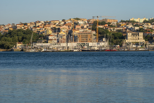 View of the Douro River reflects the golden light on the water contrasting with the terracotta rooftops of the city s buildings Porto Porto District Portugal. View of the Douro River reflects the golden light on the water contrasting with the terracotta rooftops of the city s buildings Porto Porto District Portugal.