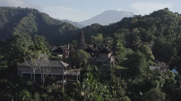 Aerial view of a traditional Balinese temple with Mount Agung Indonesia. Aerial view of a traditional Balinese temple with Mount Agung Indonesia.