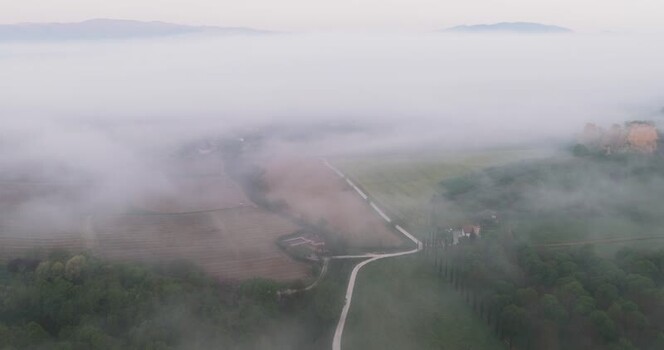 Aerial view of Balze del Valdarno landscape shrouded in morning mist Italy. Aerial view of Balze del Valdarno landscape shrouded in morning mist Italy.