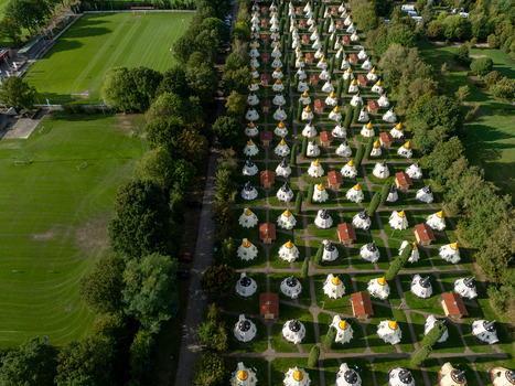 Slagharen Netherlands 03 October 2023 Aerial view of the Wigwam Parc s distinctive wigwam shaped accommodations a vibrant tapestry of red roofs and white walls amidst lush greenery. Slagharen Netherlands 03 October 2023 Aerial view of the Wigwam Parc s distinctive wigwam shaped accommodations a vibrant tapestry of red roofs and white walls amidst lush greenery.