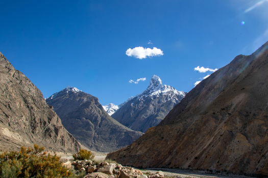 View of the rugged mountain peaks and rocky terrain of the Karakoram range under a clear blue sky at K2 Base Camp in Gilgit Pakistan. View of the rugged mountain peaks and rocky terrain of the Karakoram range under a clear blue sky at K2 Base Camp in Gilgit Pakistan.