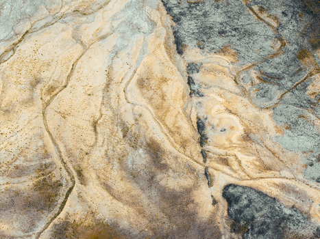Aerial view of post industrial landscape with intricate patterns of sand soil and dark mineral deposits in Konin Greater Poland Voivod Poland. Aerial view of post industrial landscape with intricate patterns of sand soil and dark mineral deposits in Konin Greater Poland Voivod Poland.
