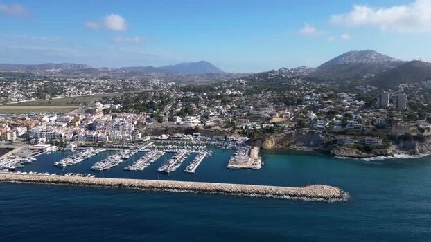 Aerial view of Moraira marina and coastal town Spain.