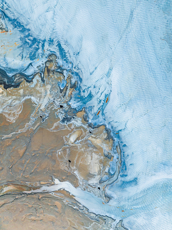 Aerial view of intricate sediment patterns and blue water channels in a coastal landscape Andalusia Spain. Aerial view of intricate sediment patterns and blue water channels in a coastal landscape Andalusia Spain.