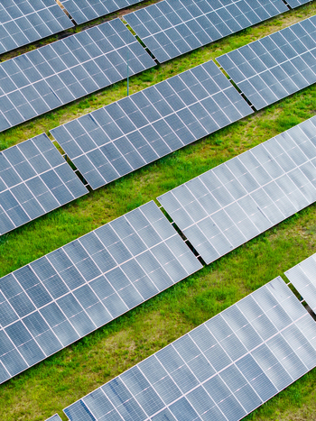 Aerial view of rows of solar panels installed in a grassy field in Olaine Olaine Municipality Latvia. Aerial view of rows of solar panels installed in a grassy field in Olaine Olaine Municipality Latvia.