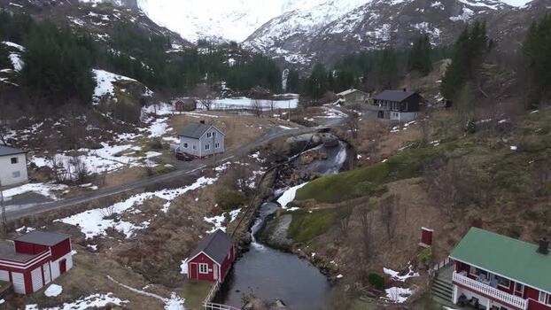 Aerial view of Lofoten landscape with houses and stream Norway.
