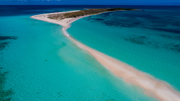 Aerial view of the white sandbar and turquoise waters of the Los Roques archipelago in Los Roques Dependencias Federale Venezuela. Aerial view of the white sandbar and turquoise waters of the Los Roques archipelago in Los Roques Dependencias Federale Venezuela.