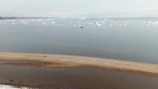Aerial view of icebergs floating near the coast Greenland. Aerial view of icebergs floating near the coast Greenland.