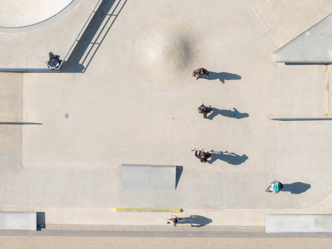 Vilnius Lithuania 20 April 2026 Aerial view of Chiune Sugihara Sakura Park showing people skateboarding on concrete ramps and surfaces under clear daylight. Vilnius Lithuania 20 April 2026 Aerial view of Chiune Sugihara Sakura Park showing people skateboarding on concrete ramps and surfaces under clear daylight.