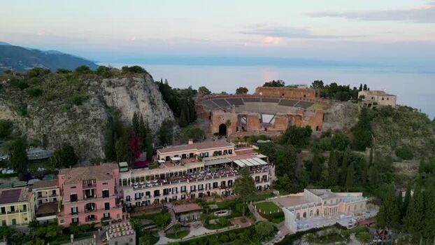 Aerial view of the Ancient Theatre of Taormina and cliffs Italy. Aerial view of the Ancient Theatre of Taormina and cliffs Italy.