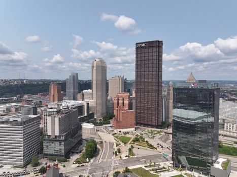 Pittsburgh United States 26 July 2026 Aerial view of the UPMC building and surrounding urban skyline in downtown Pittsburgh featuring modern glass skyscrapers and city streets.