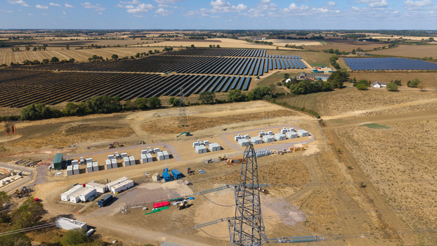 Aerial view of Eaton Socon Substation featuring extensive solar farm arrays and battery energy storage systems in the rural landscape of St. Neots England United Kingdom. Aerial view of Eaton Socon Substation featuring extensive solar farm arrays and battery energy storage systems in the rural landscape of St. Neots England United Kingdom.