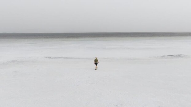 Aerial view of a person walking on the Danakil Salt Lake Ethiopia. Aerial view of a person walking on the Danakil Salt Lake Ethiopia.
